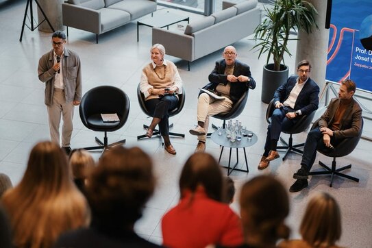 Panel discussion with Prof. Virginija Poškutė, Prof. Josef Wieland, Gediminas Judzentas, Dr. Jonathan Boyd (left to right). Moderator Tobias Grünfelder (far left).
